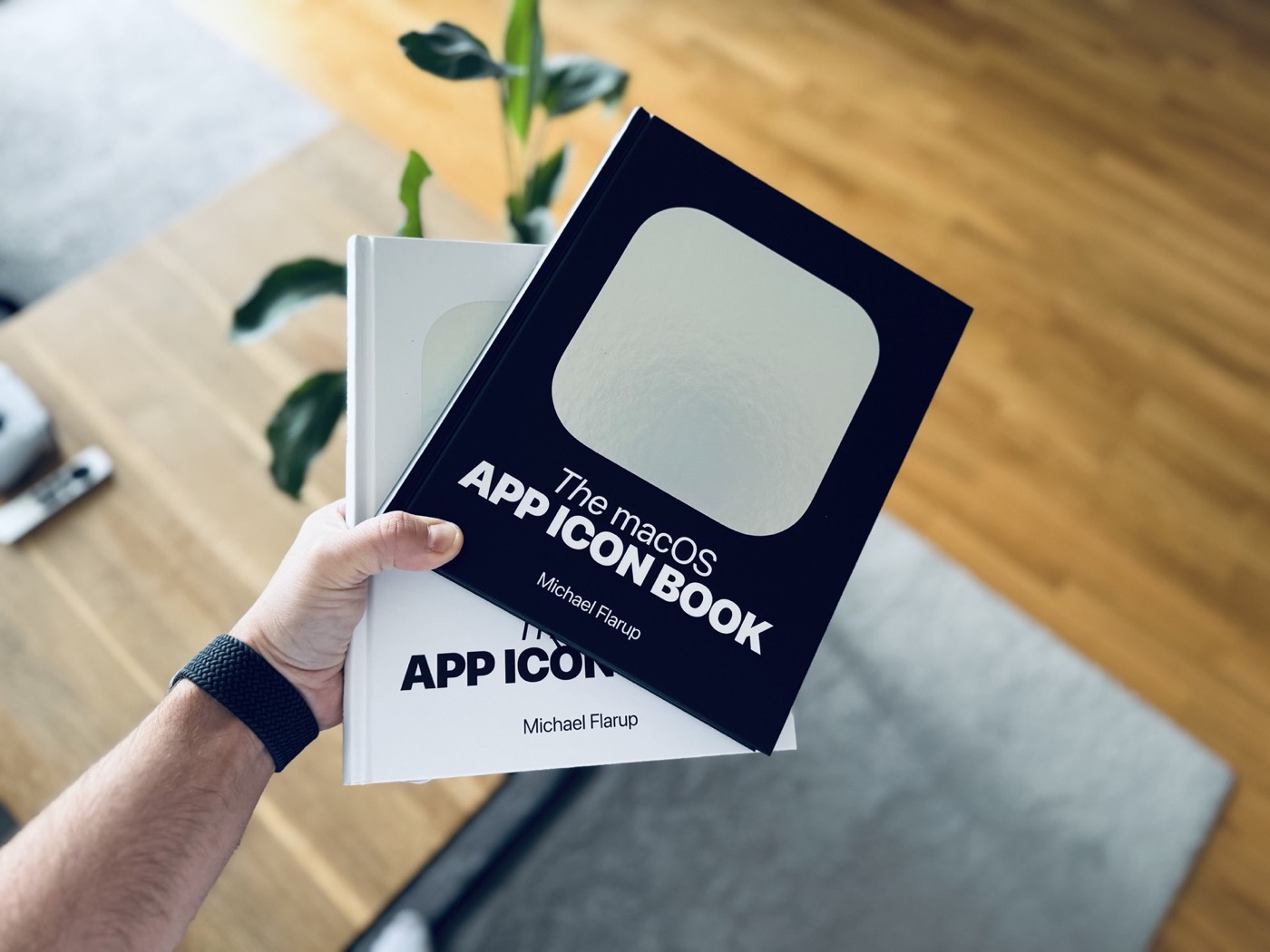 Both App Icon Books held together in a reader's hand