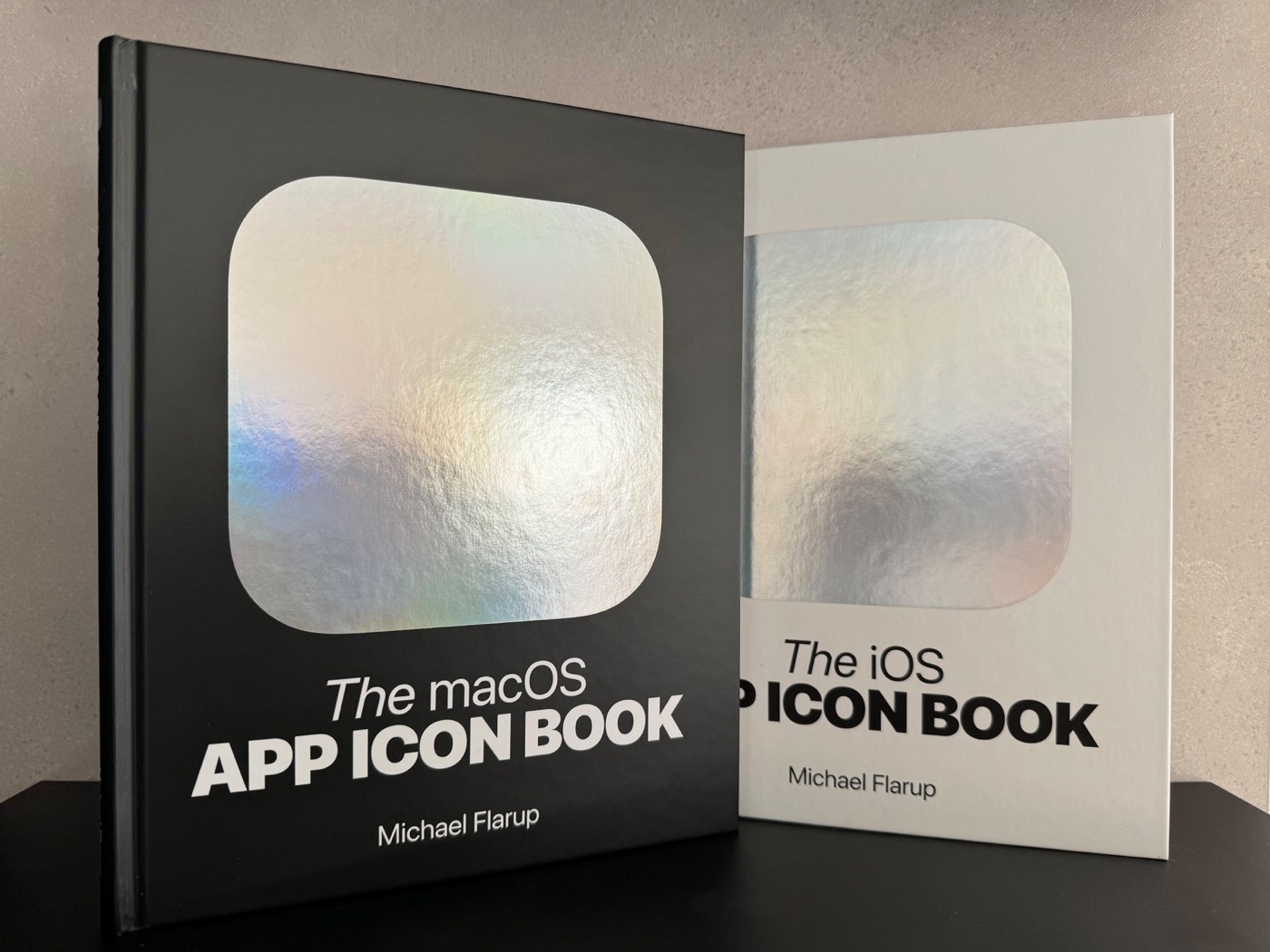The iOS and macOS App Icon Books standing together